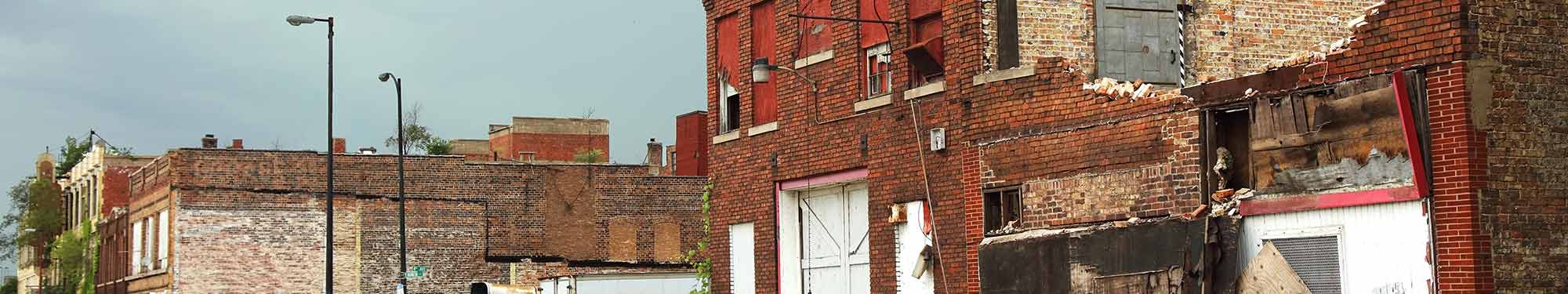 Image of damage to a commercial brick building after a tornado