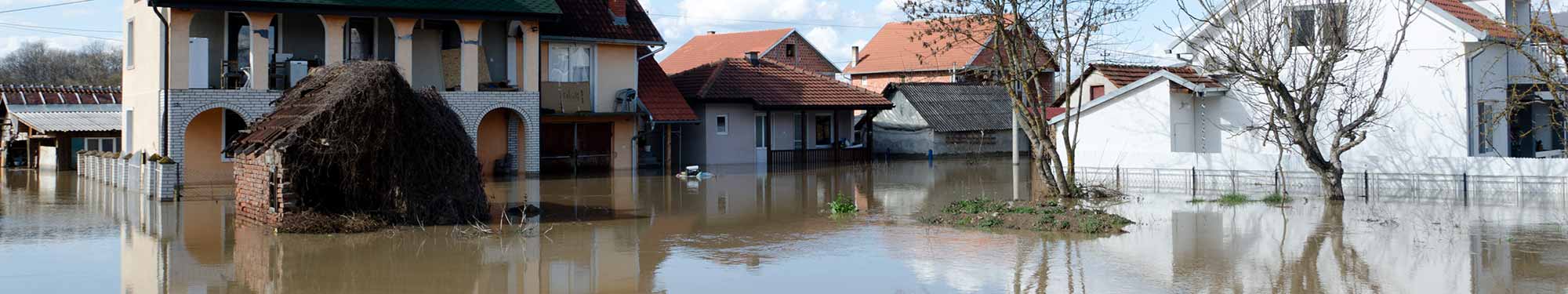 Image of several residential structures inundated by flood waters