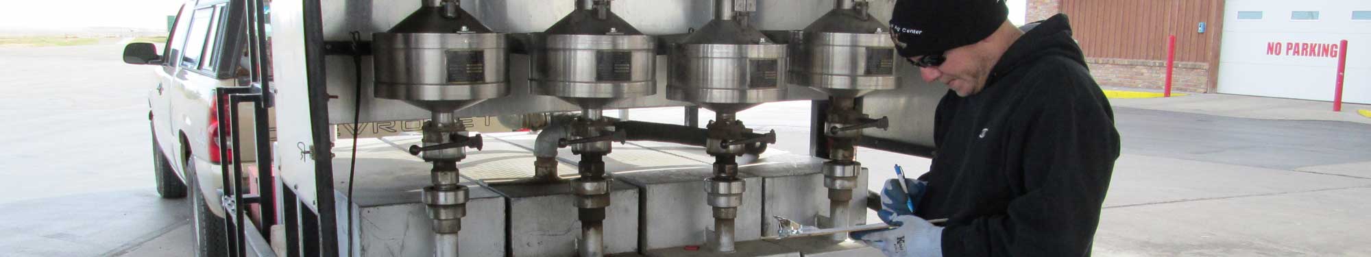 Image of inspector conducting inspection with fuel provers