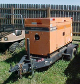 Image of orange generator on a trailer