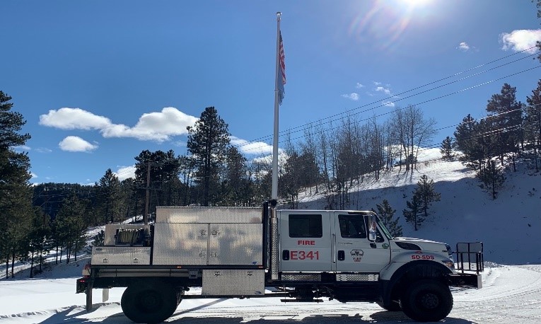 image-of Engine 341 in front of flagpole at Lead District Office
