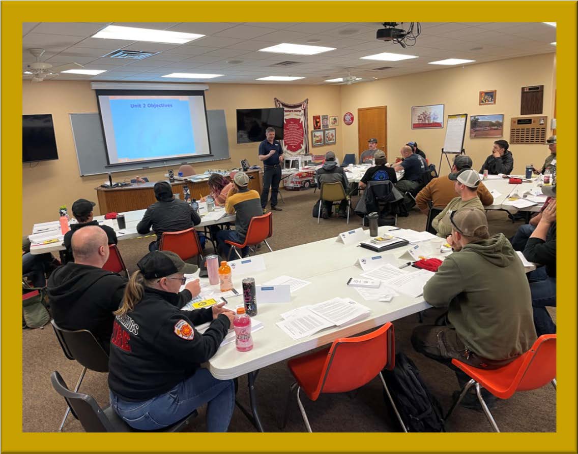 Image of students sitting at tables during wildfire training academy