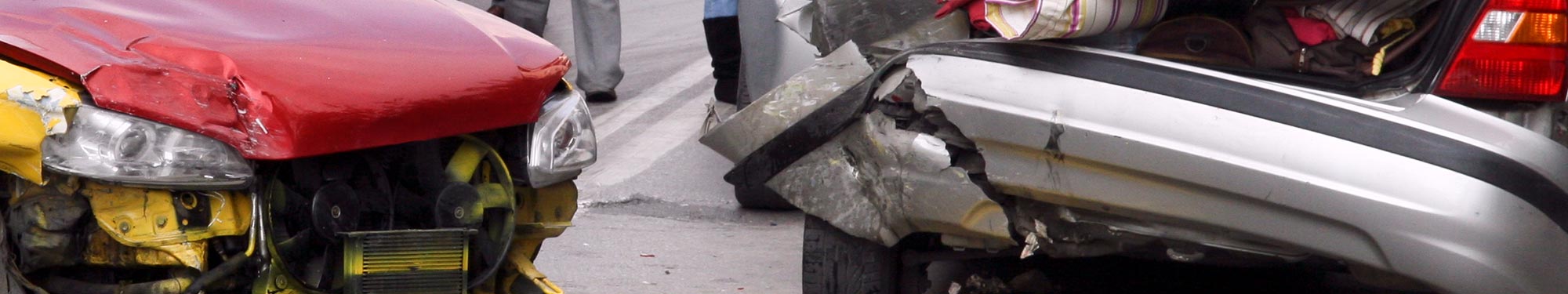Image of damage caused to two vehicles as a result of a rear-end vehicle crash